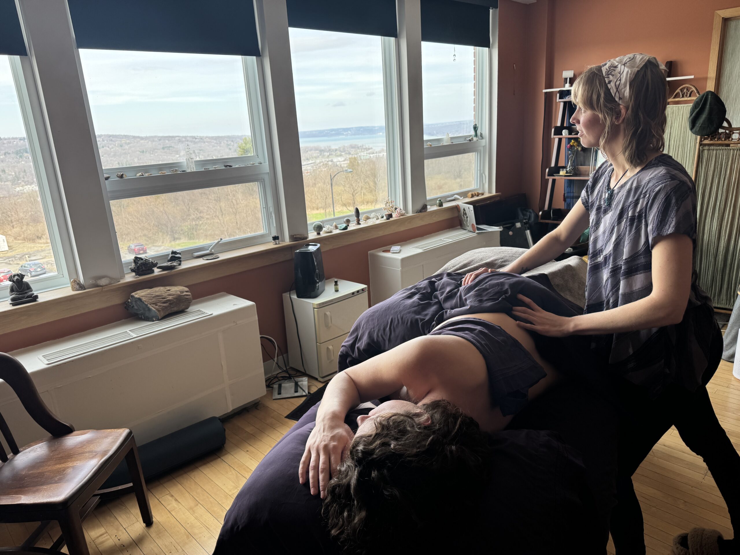 Victoria Anchor LMT Performing a massage for a client in Side-Lying Position